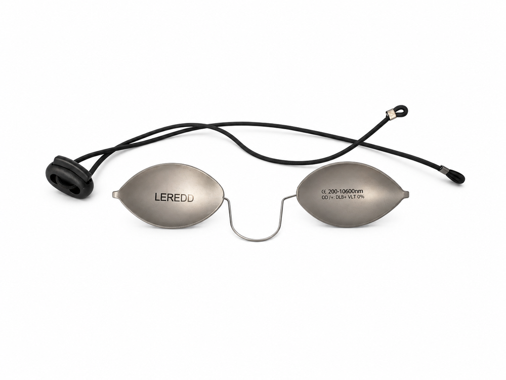 A pair of LEREDD oval-shaped silver Steel IPL LASER Blockout goggles attached with a round black elastic cord with a toggle size adjuster, shown against a plain white background.