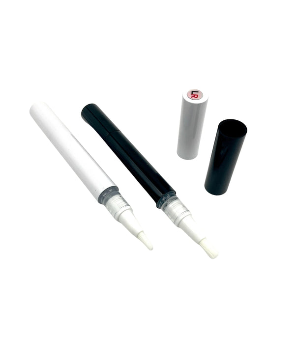 White pen with black cap on a white background
