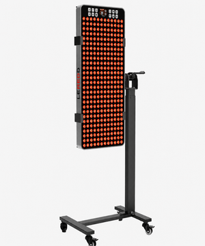 Red Light Therapy panel shining red lights mounted to a black stand on wheels mounted in a vertical position with the LEREDD branding on the side