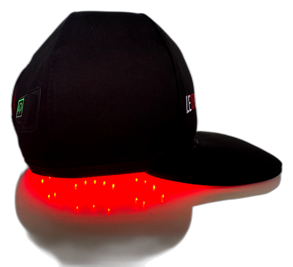 A black flat-brim cap with LED lighting along the brim, casting a bright red glow, shown on a white background with a reflection.