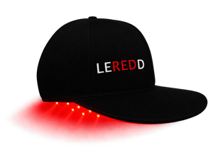 A black baseball cap with 'LEREDD' embroidered on the front, featuring glowing red LED lights along the edge of the brim, shown against a solid white background.